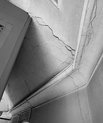 black and white photo of a cracked corner in a church