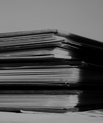 Black and white photo of stacked books