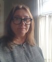 Colour headshot of female academic with glasses.