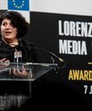 Nehal El-Sherif accepting the Lorenzo Natali Media Prize from the European Commission.